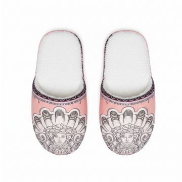 Pair of slippers with decorative design on a white background