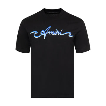 A black cotton t-shirt by AMIRI, available at Lestyle Boutique. Featuring a wave-inspired logo graphic on the chest, this tee offers a stylish and comfortable fit for casual wear.