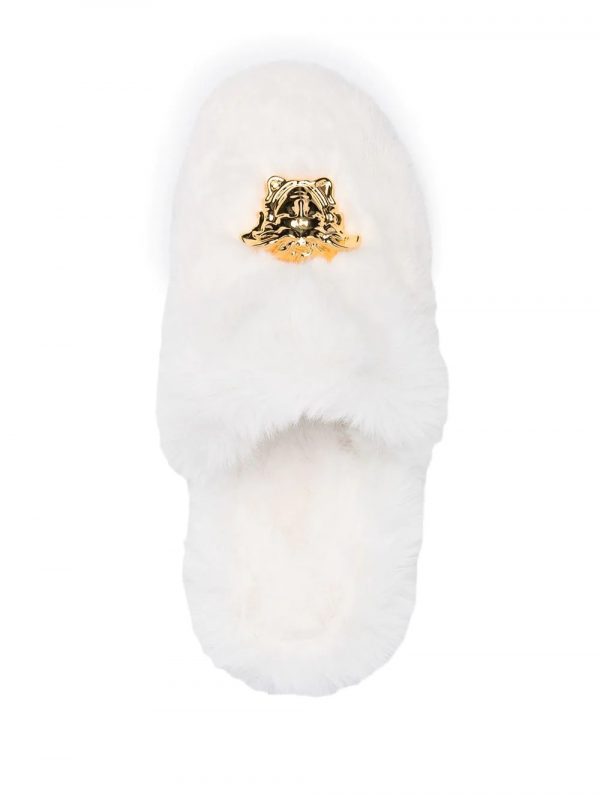 Versace Slippers featuring plush white fur with a gold Medusa emblem available at Lestyle Boutique Melbourne