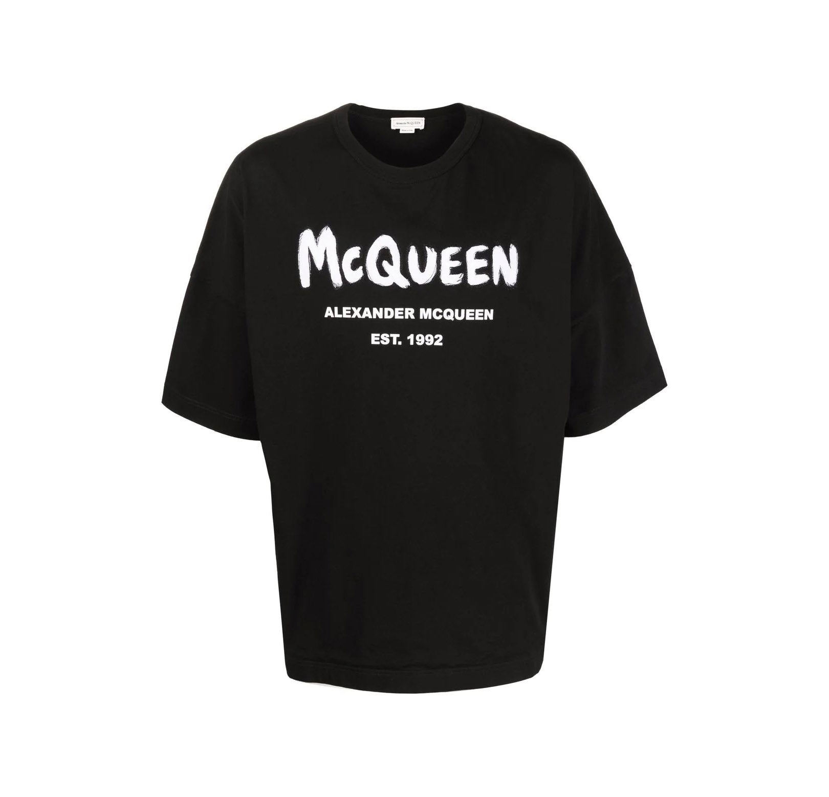Alexander McQueen black t-shirt featuring a striking graffiti logo print that embodies urban sophistication. This premium designer piece showcases a relaxed fit with short sleeves and a straight hem, perfect for casual outings or streetwear styling. Crafted with high-quality materials, it offers both comfort and durability, making it a staple for any fashion-forward wardrobe. Ideal for those who appreciate luxury and contemporary design, available at Lestyle Boutique Melbourne.