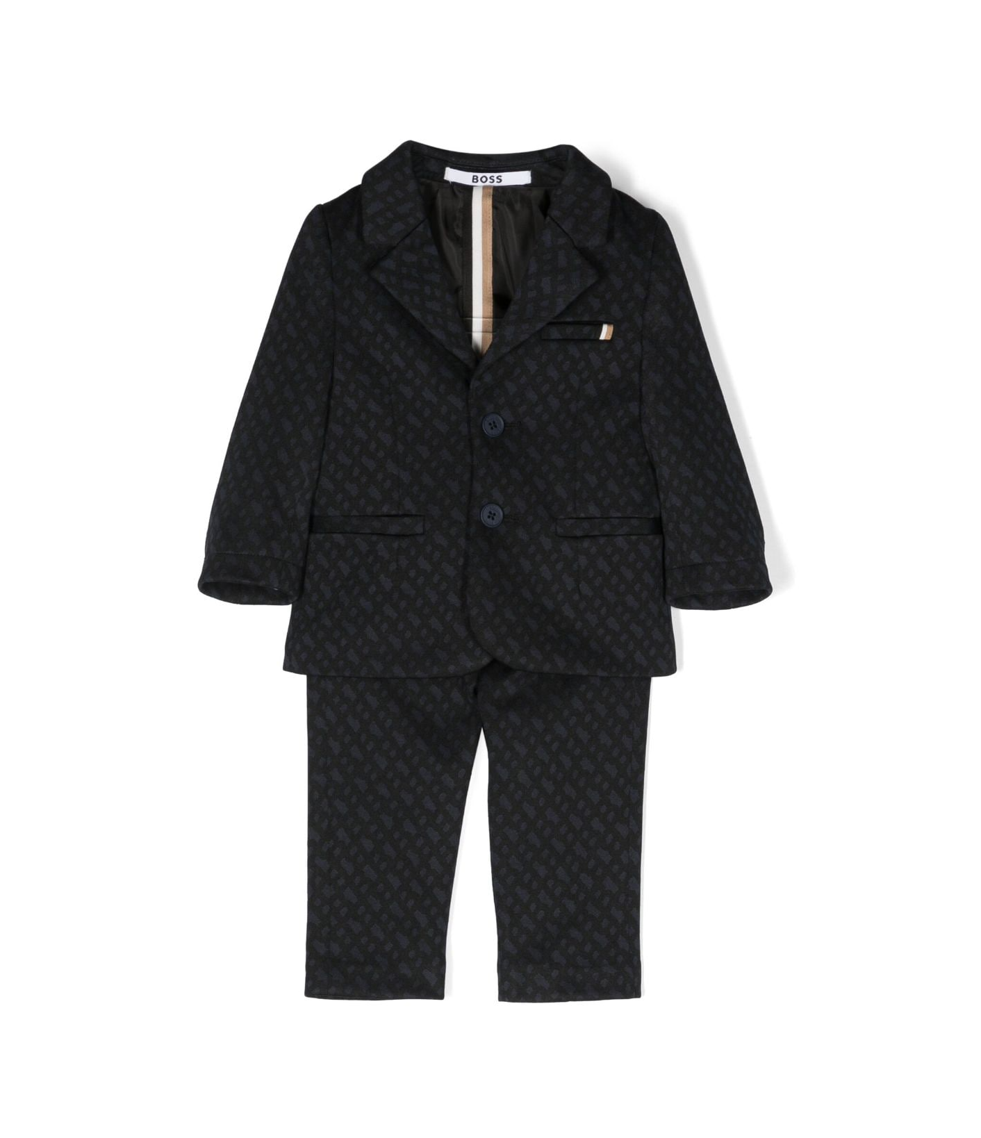 BOSS kidswear monogram single-breasted suit featuring a stylish embossed lining pattern. This premium black suit is designed for young boys, showcasing classic lapels and long sleeves for a sophisticated look. The front button fastening and three front pockets add functionality, while the straight-leg design ensures a modern fit. Perfect for formal occasions or special events, this luxury piece combines quality craftsmanship with a designer aesthetic, available at Lestyle Boutique Melbourne.
