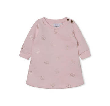 BOSS KIDSWEAR pale pink cotton dress featuring an all-over logo print with a metallic finish. This stylish crew neck design includes long sleeves, ribbed cuffs, and a curved hem, making it perfect for casual outings or special occasions. The heart motif adds a playful touch, while the button fastening at the shoulder ensures easy dressing. Crafted from high-quality organic cotton blend, this dress is both comfortable and fashionable for young girls, available at Lestyle Boutique Melbourne.
