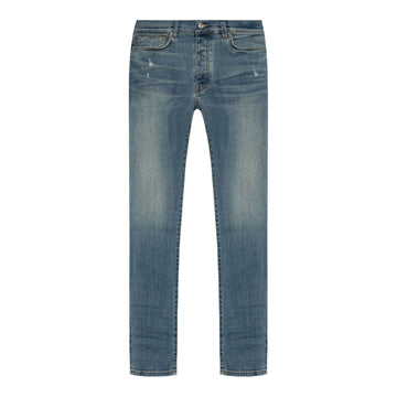 A pair of blue skinny jeans by AMIRI, available at Lestyle Boutique. These low-rise jeans feature a stretch construction, faded detailing, whiskering effects, and a classic five-pocket design for a modern and sleek fit.