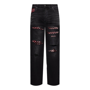 A pair of black distressed jeans by AMIRI, available at Lestyle Boutique. These jeans feature unique bandana inserts, a straight-leg fit, concealed button fastening, and a classic five-pocket design.