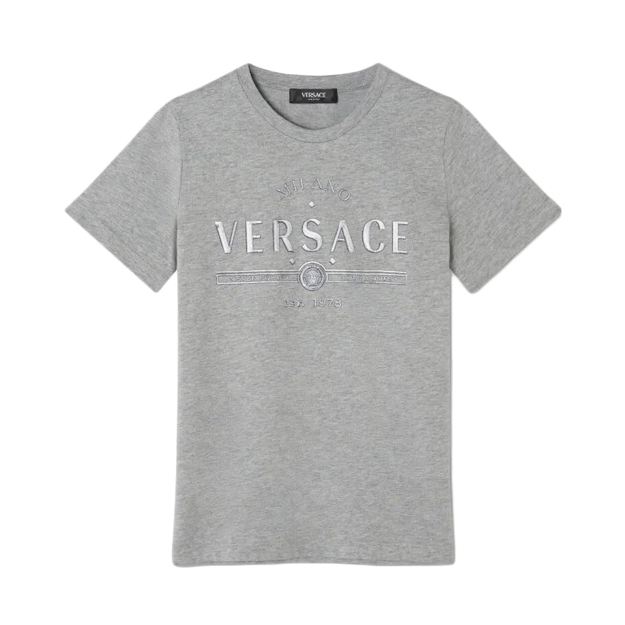 Versace Kids Logo T-Shirt in grey mélange cotton, featuring a textured Versace logo motif with a subtle glitter effect, crewneck cut, and short sleeves, available at Lestyle Boutique.