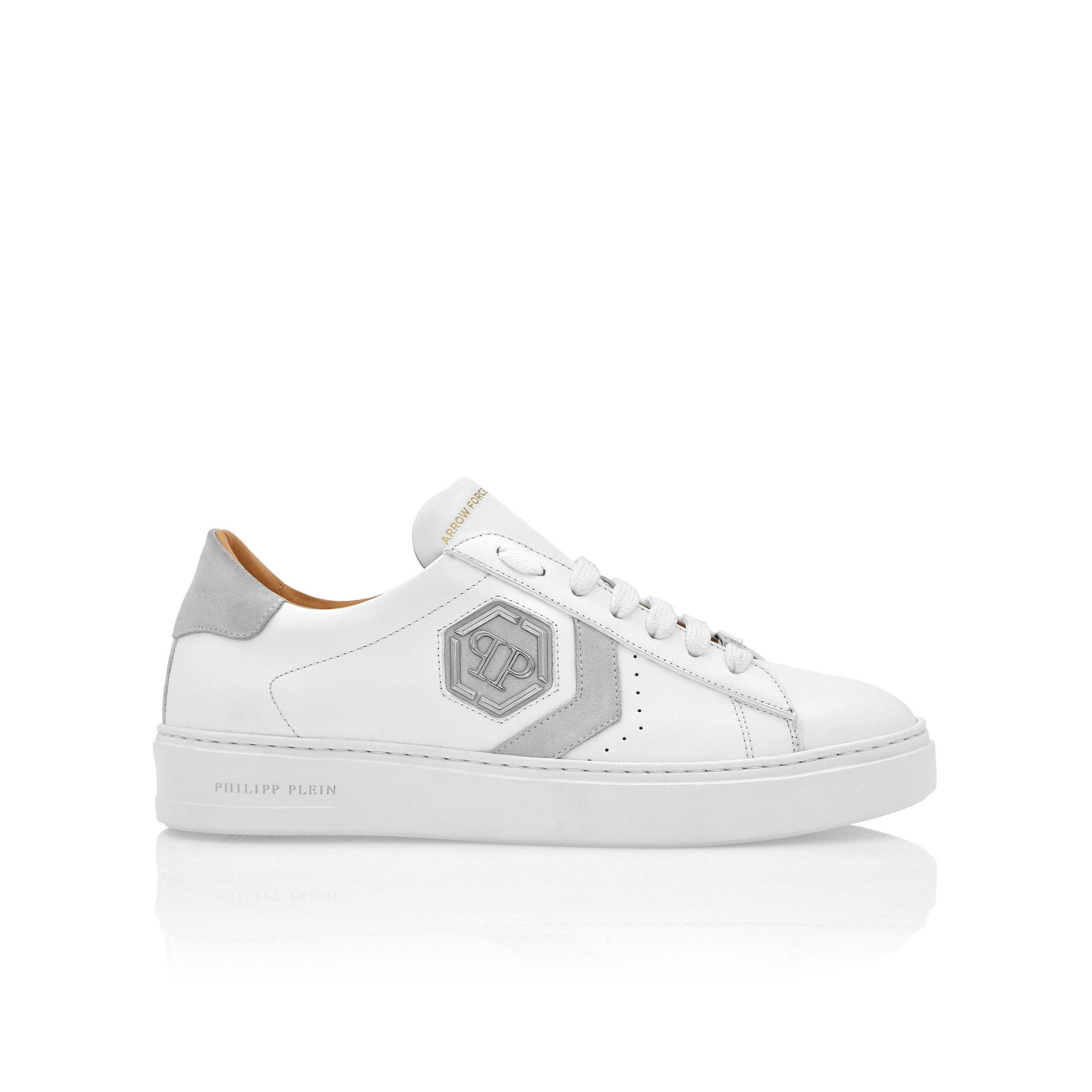 Philipp Plein white Lo-Top Leather Arrow Force sneakers with PP Hexagon logo and suede accents, available at Lestyle Boutique.