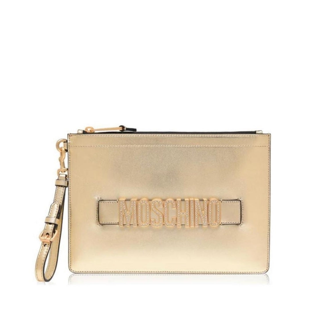 Moschino metallic gold clutch featuring crystal-embellished logo lettering, top zip closure with gold-tone hardware, and a detachable wrist strap, available at Lestyle Boutique 136 Little Collins St.