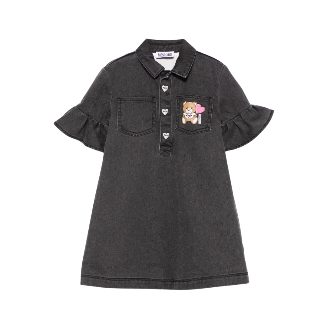 Moschino Kids girls' black denim shirt dress featuring a collar, partial snap button placket, short sleeves with ruffled hems, chest pockets, and a Moschino Teddy Bear patch, available at Lestyle Boutique 136 Little Collins St.