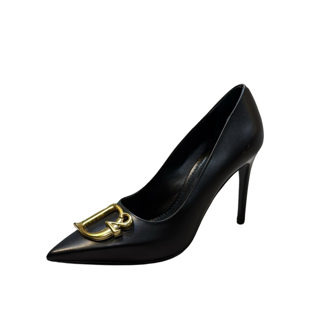 Dsquared2 black pointed toe pumps featuring a large gold-tone D2 logo hardware on the vamp and a stiletto heel, available at Lestyle Boutique 136 Little Collins St.