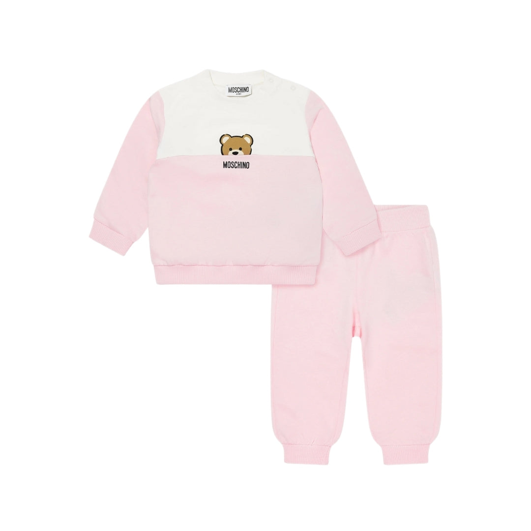Moschino Kids/Baby two-piece set including a color-block (white/pink) sweatshirt with Teddy Bear print and matching pink pants with ribbed cuffs, available at Lestyle Boutique 136 Little Collins St.