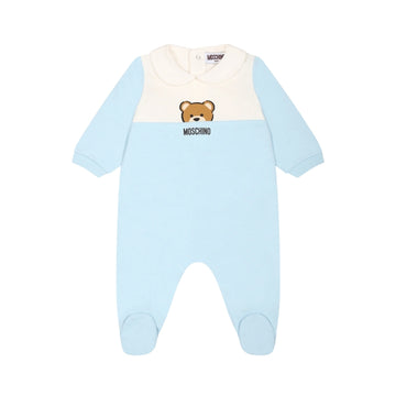 Moschino Kids Baby light blue organic cotton footed babygrow featuring a color-block design with white/cream chest panel, Peter Pan collar, long sleeves, snap closure, and Teddy Bear print, available at Lestyle Boutique 136 Little Collins St.