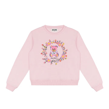 Moschino Kids pink cotton sweatshirt with crew neck and long sleeves, featuring a Teddy Bear print surrounded by a floral wreath on the chest and ribbed trims, available at Lestyle Boutique 136 Little Collins St.