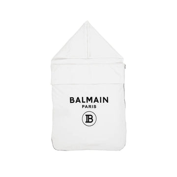 Luxury Balmain kids white cotton sleeping bag featuring a stylish hood with snap buttons and a convenient side zipper. This premium designer piece is lightly padded for comfort and showcases the iconic front logo, making it perfect for your little one's cozy moments. Ideal for newborns and toddlers, this elegant sleeping bag combines functionality with high-quality craftsmanship, ensuring a restful sleep. Available at Lestyle Boutique Melbourne.