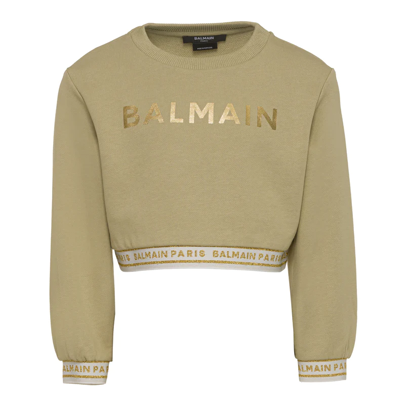 Balmain kids sweatshirt in a stylish green hue, crafted from premium 100% cotton for comfort and durability. This designer piece features a crew neck and a bold logo print, making it a standout addition to any child's wardrobe. Perfect for casual outings or playdates, this luxury sweatshirt combines quality and style effortlessly, available at Lestyle Boutique Melbourne.