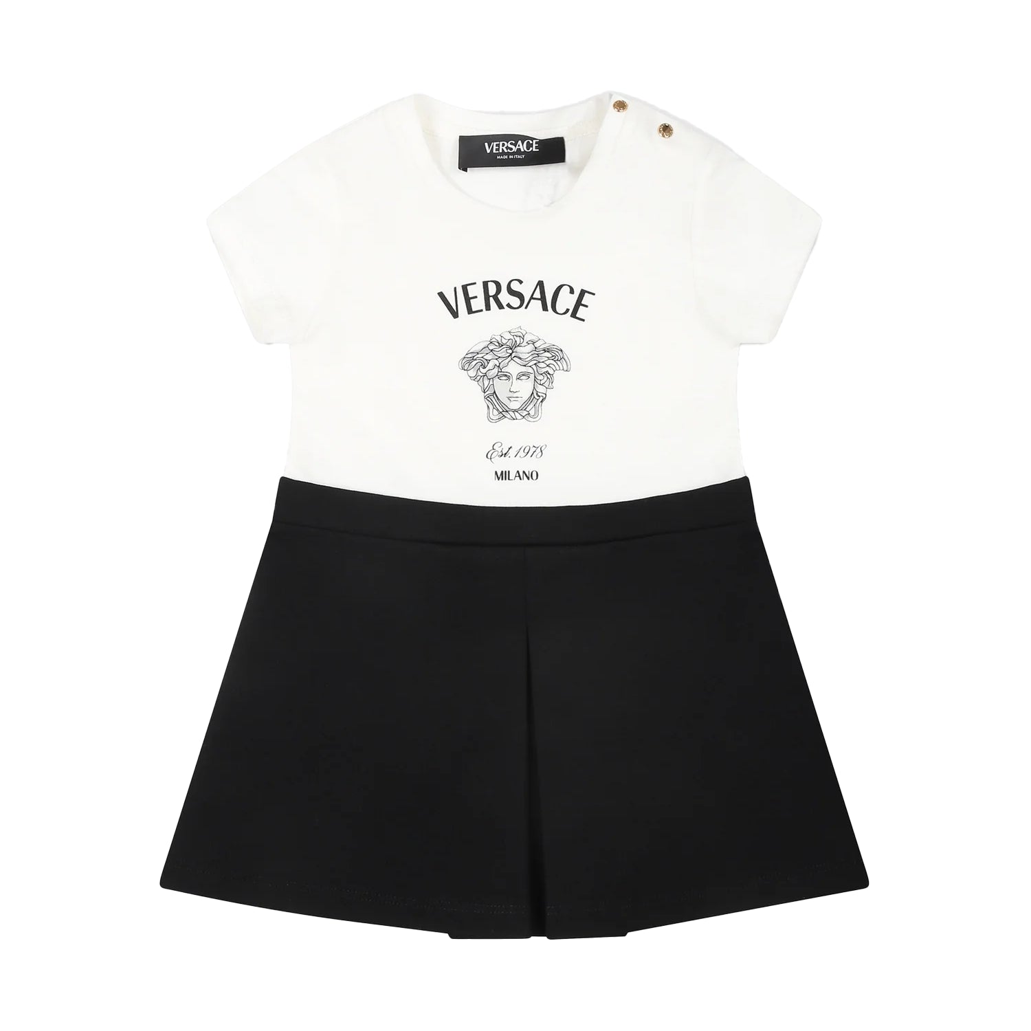 The Versace Black Dress for Baby Girl from Lestyle Boutique in a stylish white and black colour combination, featuring a cotton jersey top, flared Milano stitch skirt, and iconic Versace and Medusa logos on the front.
