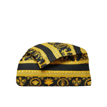 Black and gold patterned fabric on a white background, available at Lestyle Boutique 136 Little Collins St.