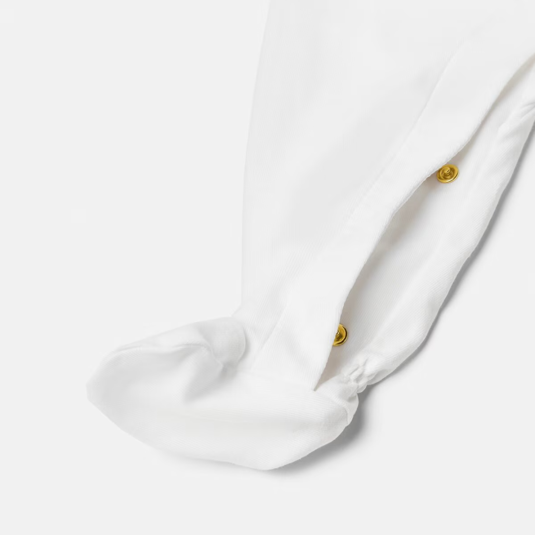 Versace Baby Sleepsuit featuring studded Medusa motif available at Lestyle Boutique Melbourne