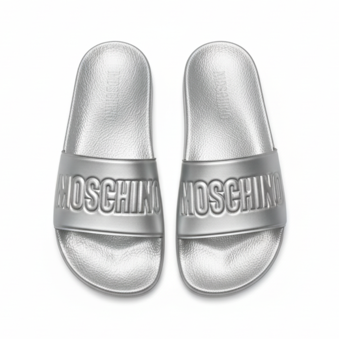 MOSCHINO slides featuring a metallic logo-embossed strap, available at Lestyle Boutique Melbourne