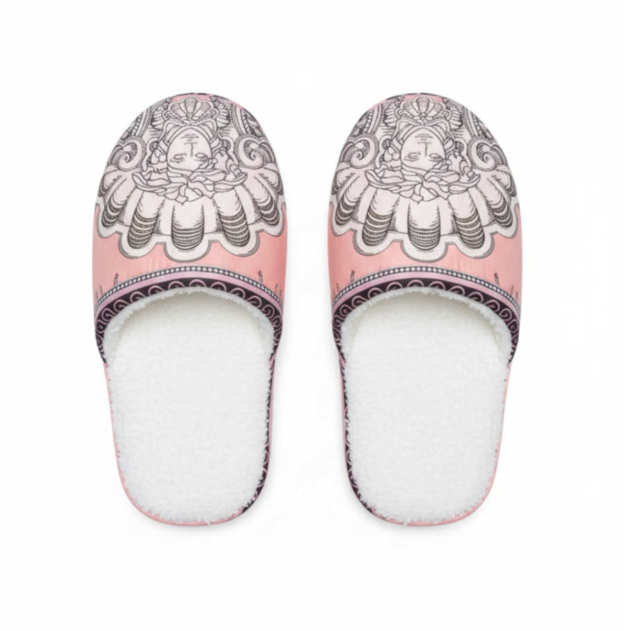 Pair of slippers with decorative design on a white background