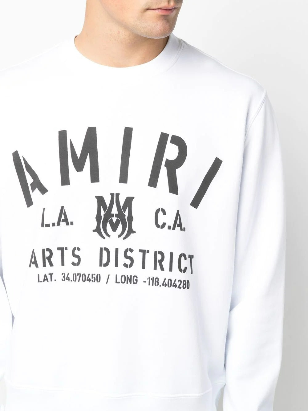 Luxury AMIRI white sweatshirt featuring a bold black logo print across the chest. This designer piece showcases a classic crew neck design with a straight hem for a relaxed fit. Crafted from high-quality materials, it offers both comfort and style, making it perfect for casual outings or lounging. Ideal for fashion-forward individuals seeking premium streetwear, available at Lestyle Boutique Melbourne.
