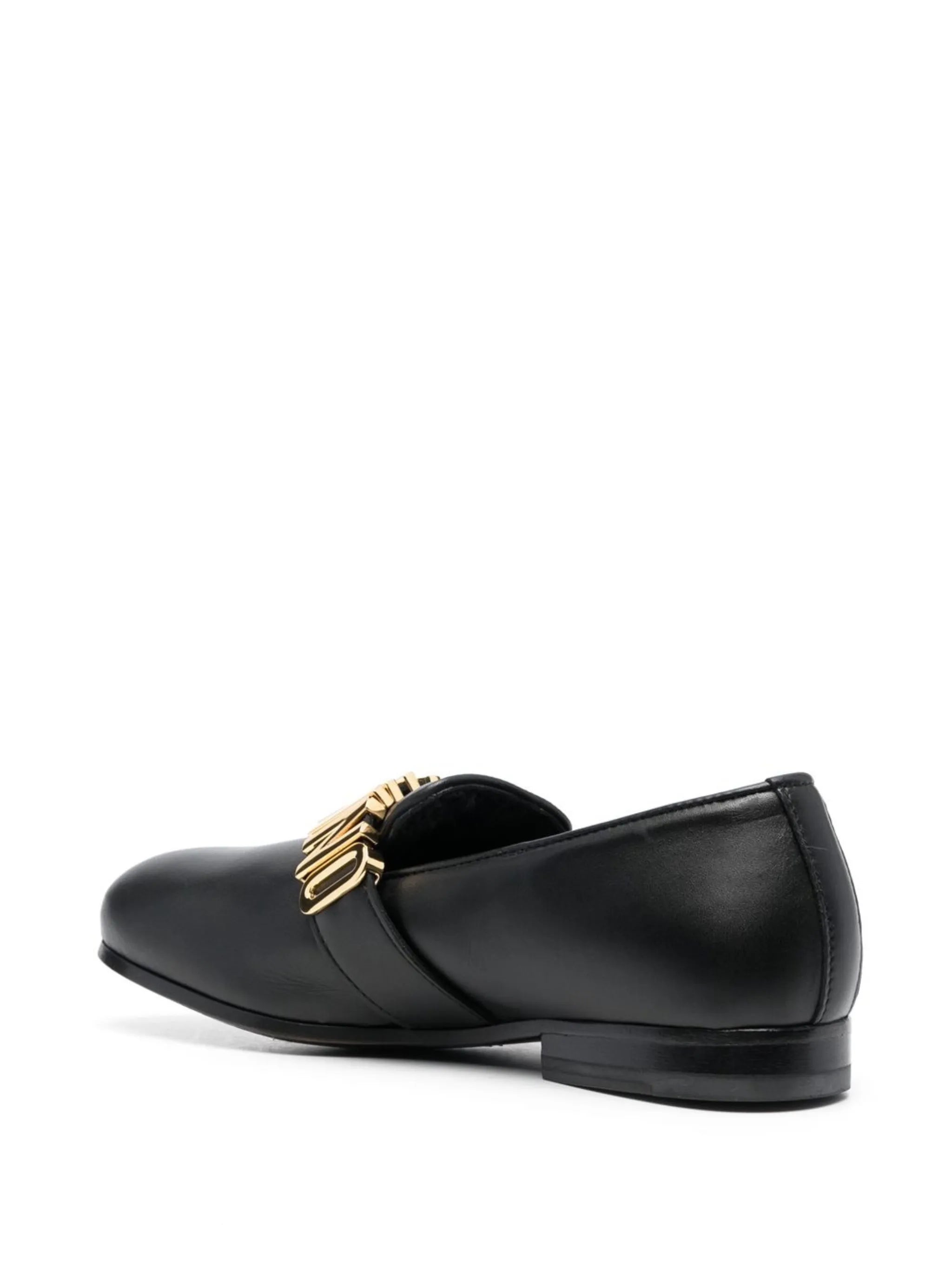 Moschino black leather loafers featuring gold-tone logo plaque available at Lestyle Boutique Melbourne