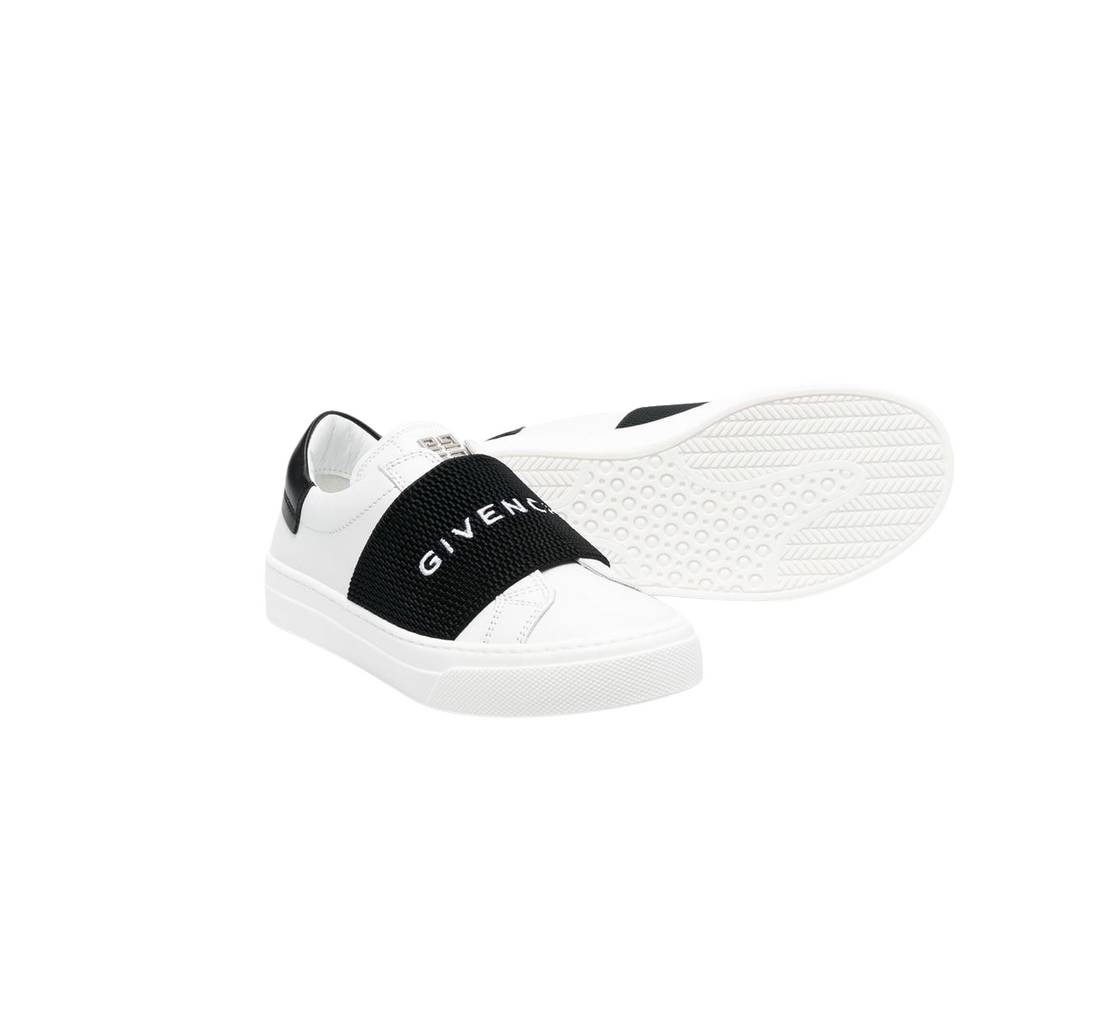 White and black Givenchy Kids logo-strap leather sneakers featuring a slip-on style and rubber sole, available at Lestyle Boutique Melbourne.