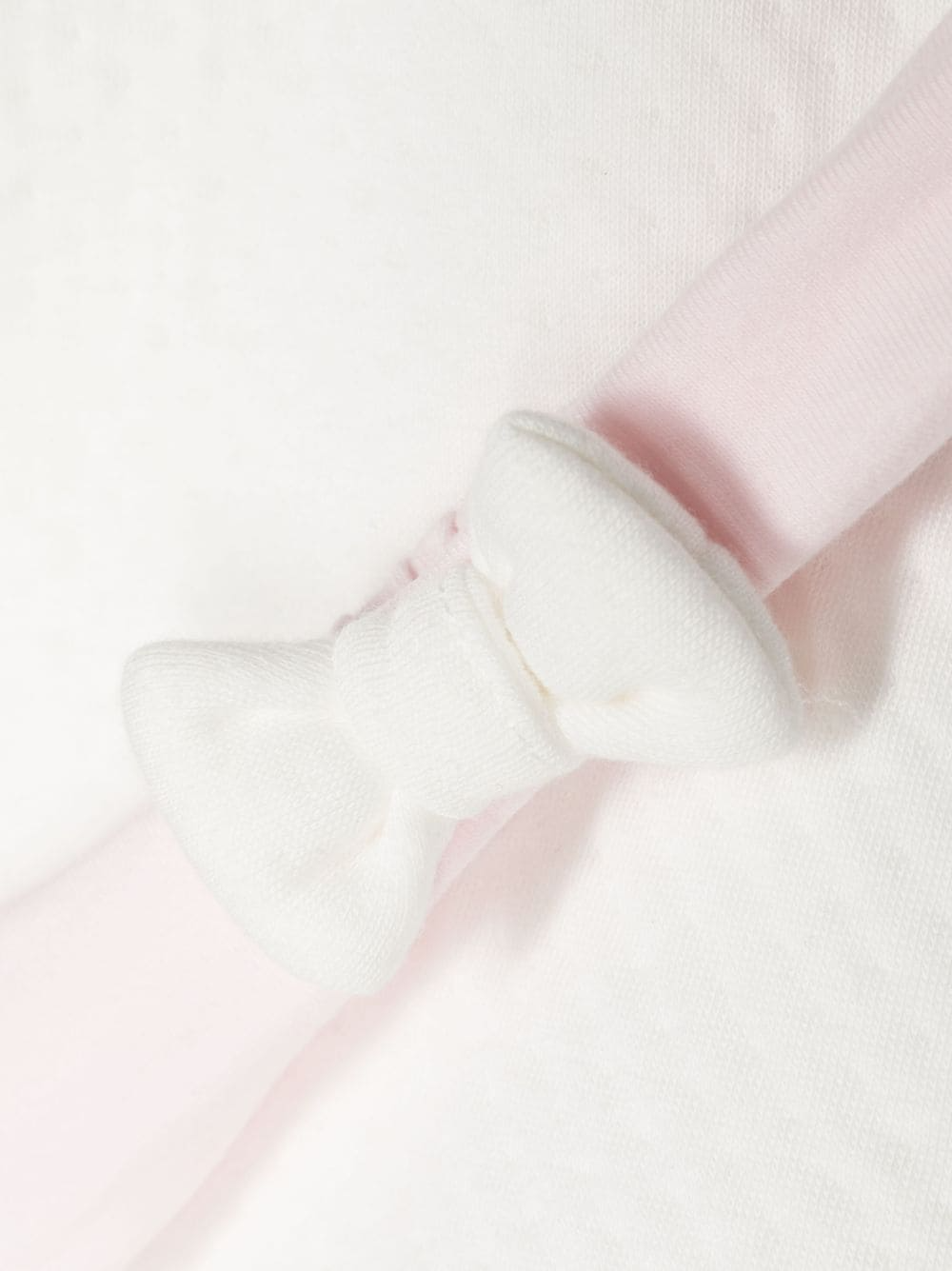BOSS KIDSWEAR pyjama set featuring a soft white fabric with an embroidered logo on the front. This luxury children's sleepwear includes a classic hood and front zip fastening for easy wear. The design is complemented by ribbed cuffs and hem, elasticated waistbands, and tapered legs for a comfortable fit. Perfect for cozy nights, this premium set is ideal for young ones who appreciate style and comfort, available at Lestyle Boutique Melbourne.