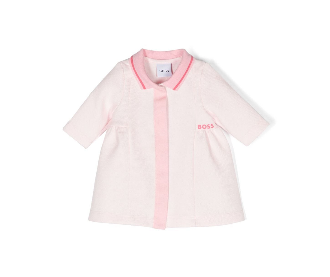 BOSS kidswear polo dress in light pink, crafted from a premium cotton blend with a piqué weave. This stylish dress features an embroidered logo at the chest and a classic polo collar, ensuring a chic yet comfortable fit for young girls. The short sleeves and straight hem add a playful touch, making it perfect for casual outings or special occasions. Designed for quality and style, this luxury piece is a must-have for any fashionable child's wardrobe, available at Lestyle Boutique Melbourne.
