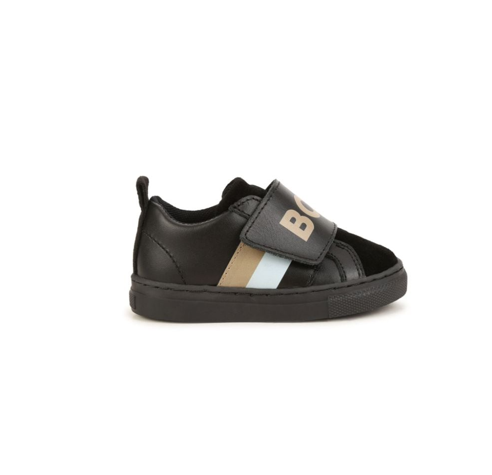 BOSS kidswear sneakers featuring a stylish black design with logo print and striped detailing. These premium children's shoes offer a comfortable fit with a round toe and front touch-strap fastening for easy wear. Crafted with high-quality materials, they showcase a branded leather insole and a durable flat rubber sole, making them perfect for active kids. Ideal for casual outings or playdates, these sneakers combine luxury and practicality, available at Lestyle Boutique Melbourne.