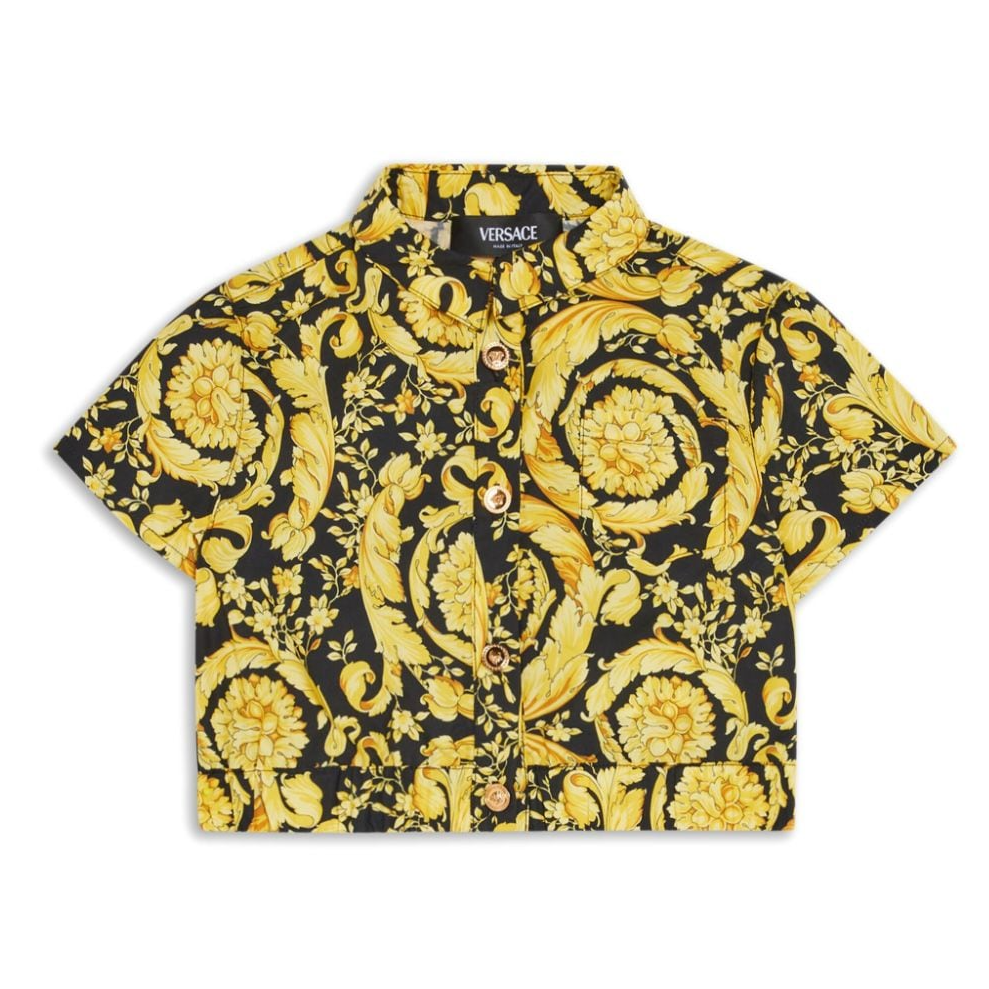 Yellow and black patterned shirt with Versace logo on a white background
