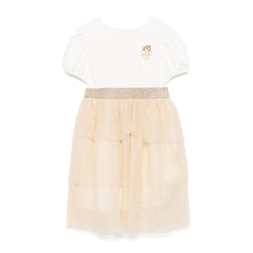 Moschino Kids Logo Patch Dress in ivory and beige with a glittery skirt and cute teddy logo patch, available at Lestyle Boutique Melbourne.