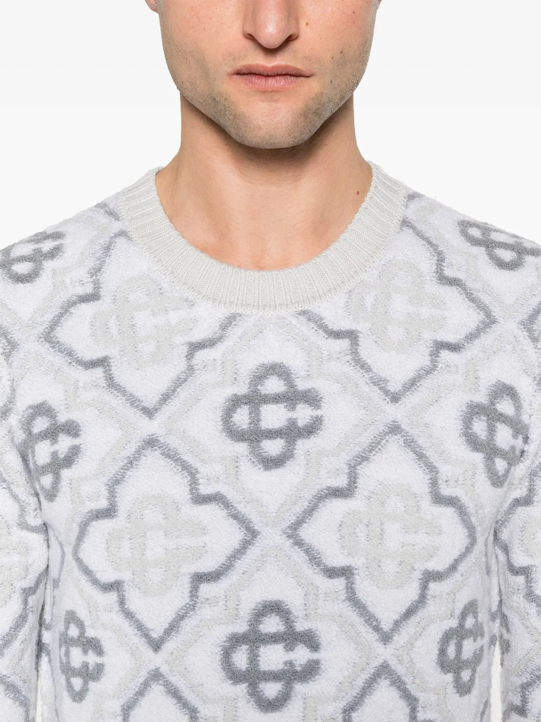 Casablanca light grey monogram sweater with ribbed cuffs and a crew neck, featuring a premium merino wool blend, available at Lestyle Boutique.