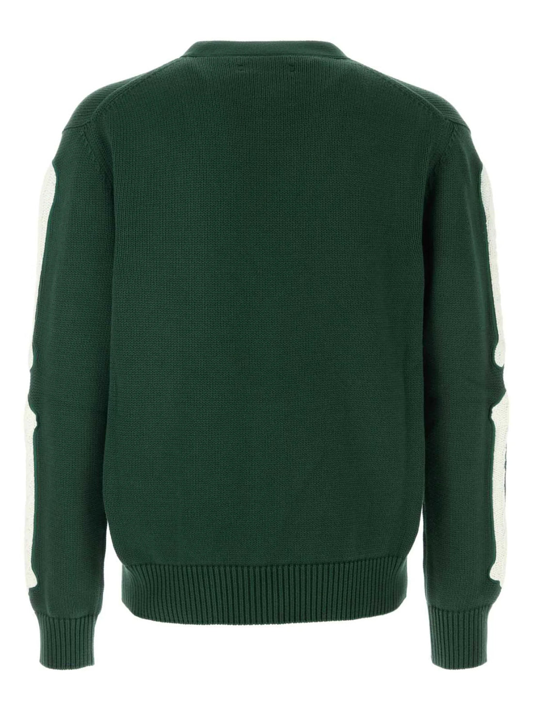 A forest green cotton cardigan by AMIRI, available at Lestyle Boutique. This cardigan features bone embroidery on the sleeves, a V-neck, front button fastening, and ribbed detailing for a stylish and contemporary look.