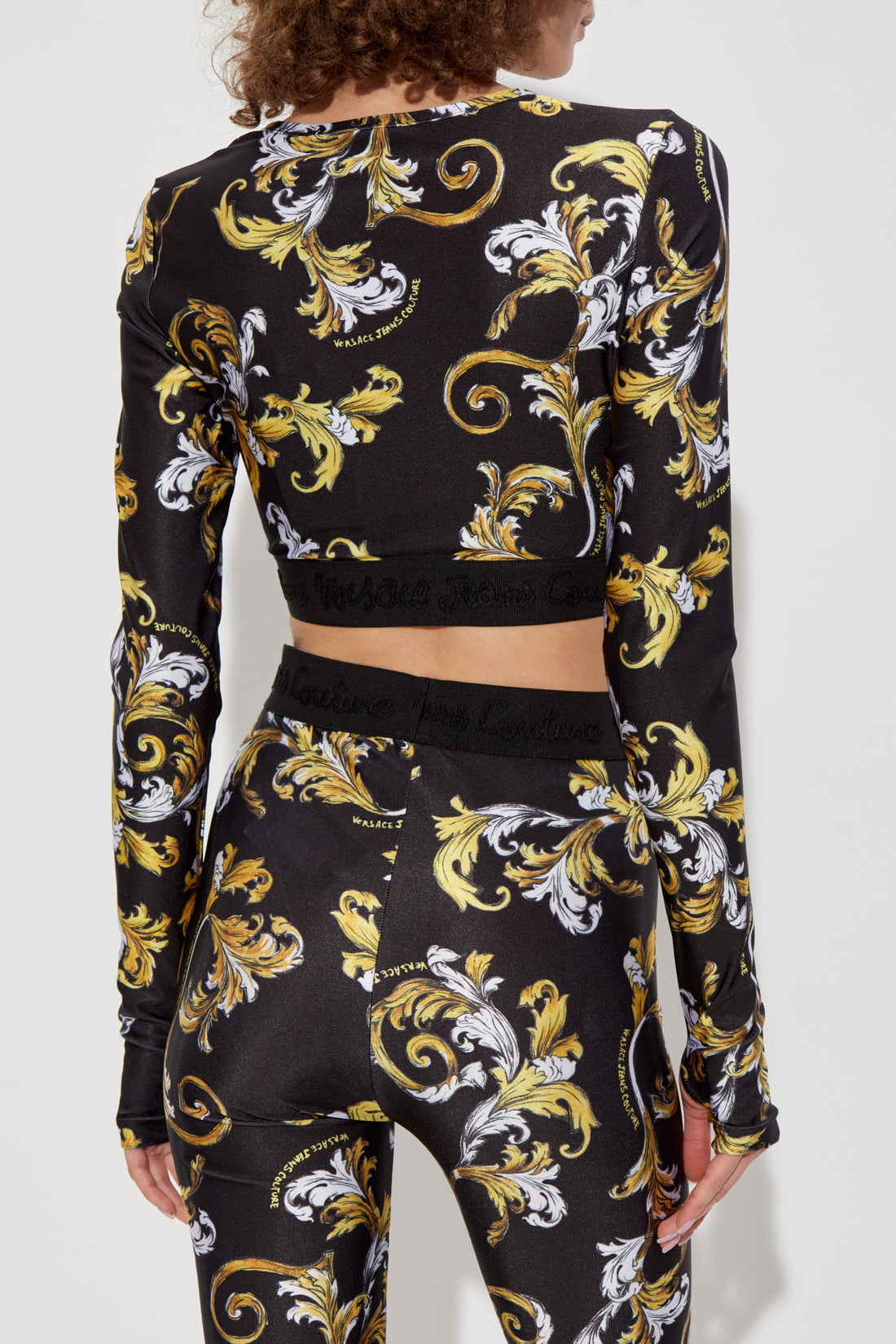 Versace Jeans Couture Black Crop Top with Outline Barocco print, featuring a sophisticated design and modern fit, available at Lestyle Boutique.