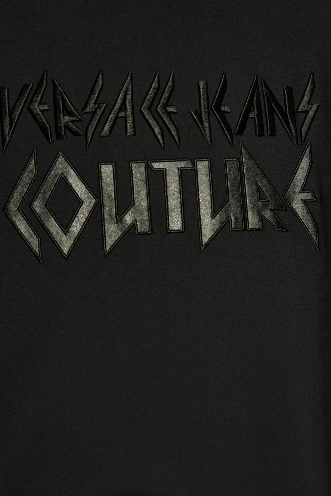 Versace Jeans Couture black T-shirt featuring an embroidered metallic logo, short sleeves, and a classic crew neck, available at Lestyle Boutique.