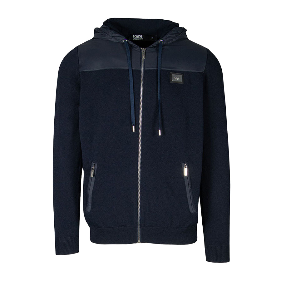 Karl Lagerfeld navy blue zip-up jacket with a sleek silhouette and logo on the chest, available at Lestyle. A stylish and comfortable layering piece for cooler weather.