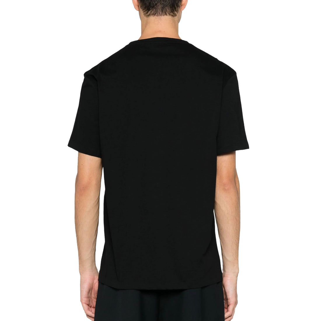 Alexander McQueen black t-shirt featuring a bold graffiti-style logo print in vibrant red. This luxury designer piece showcases a relaxed fit with short sleeves and a straight hem, crafted from high-quality materials for ultimate comfort. Perfect for casual outings or streetwear style, this t-shirt embodies premium fashion with its striking design and exceptional craftsmanship, available at Lestyle Boutique Melbourne.