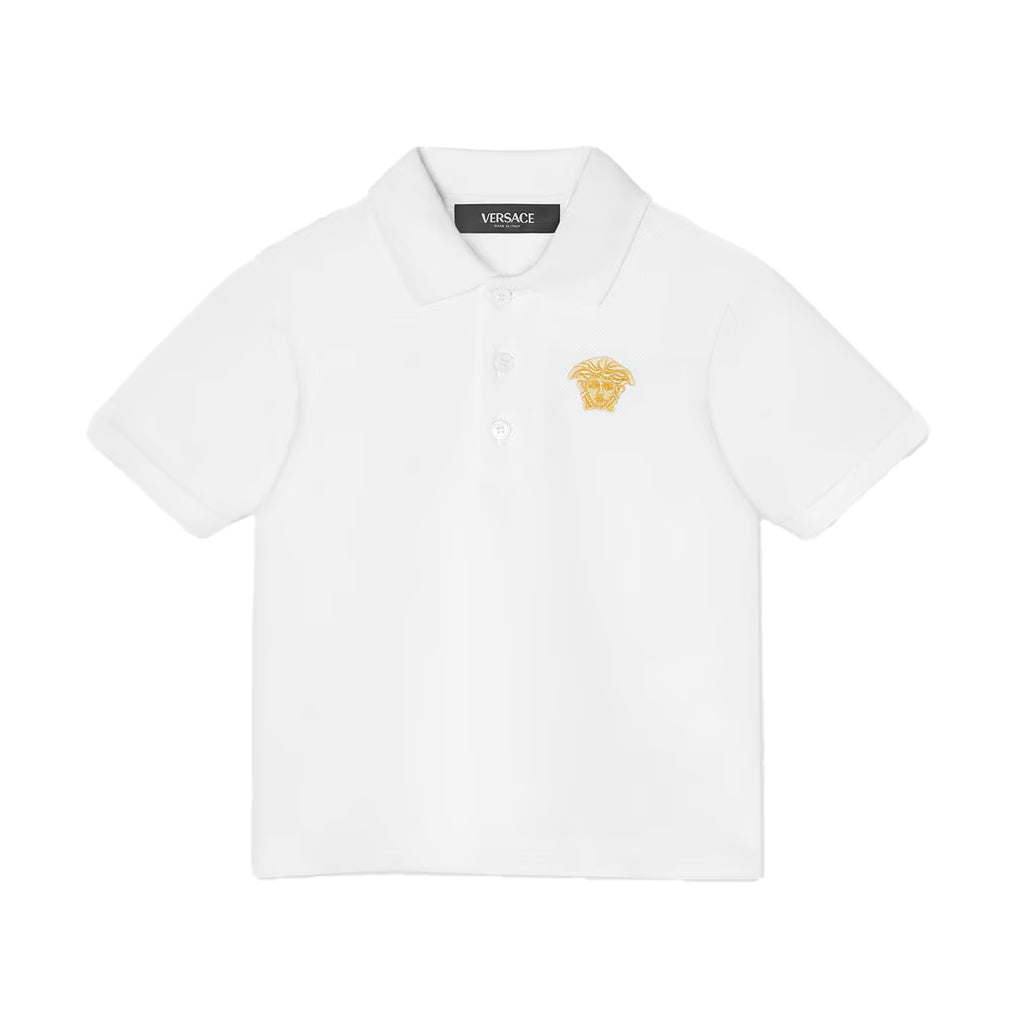 The Versace Embroidered Medusa Baby Polo Shirt from Lestyle Boutique in a clean white colour with a printed iconic Medusa motif embroidered on the chest, featuring short sleeves, a pointed collar, and a three-button placket.