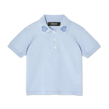 The Versace Embroidered Medusa Baby Polo Shirt from Lestyle Boutique in a charming light blue colour featuring the iconic Medusa Kids embroidery on the collar, short sleeves, a pointed collar, and a three-button placket.