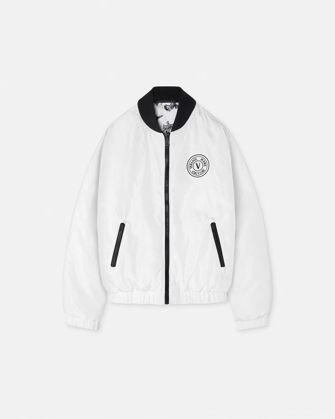 Versace Jeans Couture Outline Barocco Reversible Puffer Jacket in white and black print, featuring a detachable hood and dual design for versatile styling. Crafted for warmth and elegance, available at Lestyle Boutique.