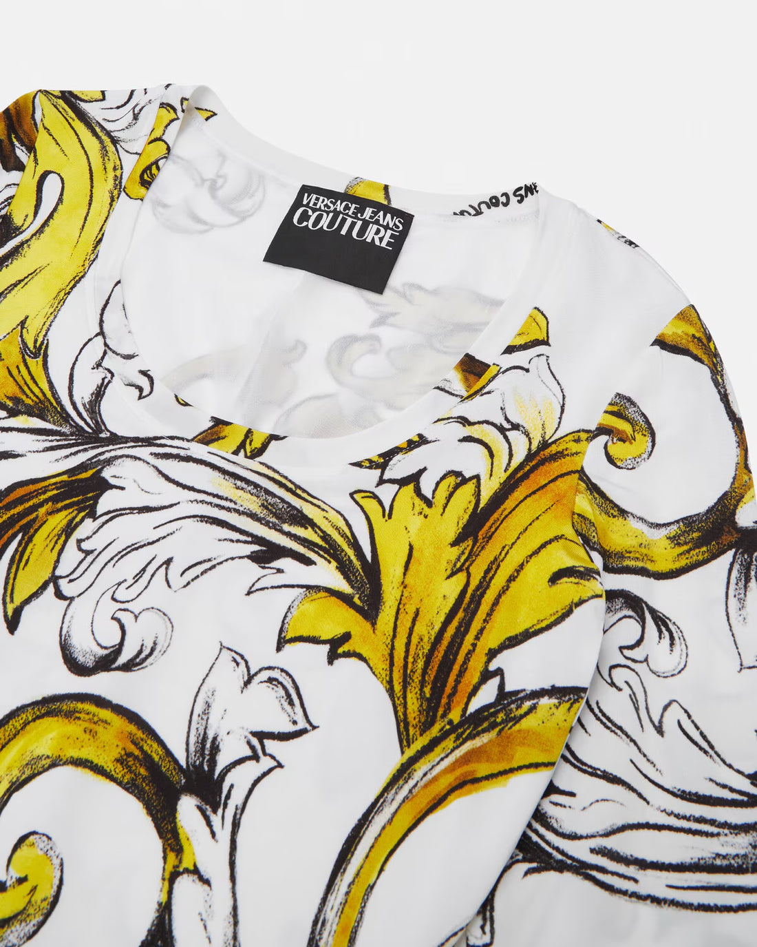 Versace Jeans Couture White Midi Dress with Outline Barocco print, long sleeves, and a round neckline, available at Lestyle Boutique.
