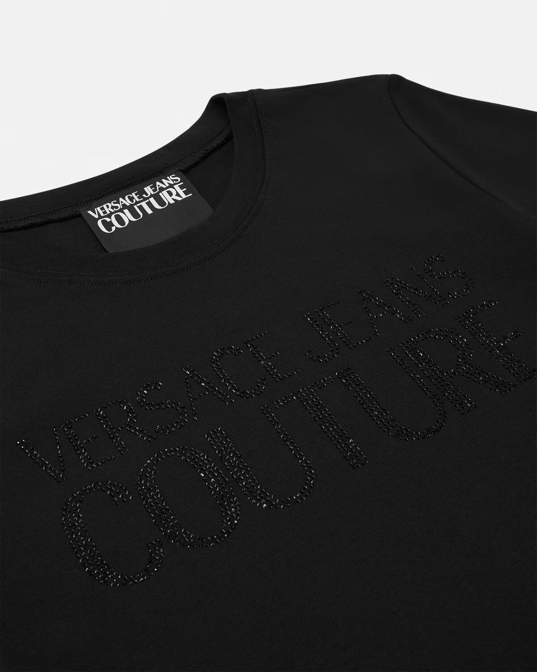 Versace Jeans Couture Black Crystal Institutional Logo T-Shirt Dress featuring a shimmering logo embellishment on the front, crafted from premium cotton blend for a chic and stylish look, available at Lestyle Boutique.