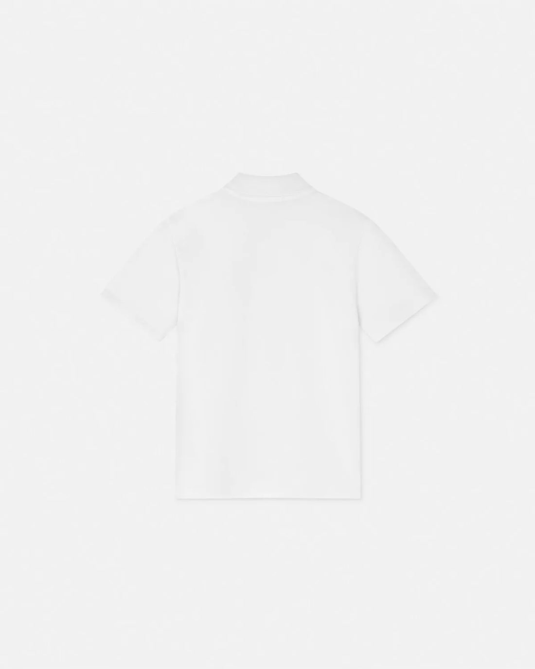 Versace Kids Short-Sleeved Polo Shirt in white, featuring a breathable cotton piqué fabric, Medusa Kids motif embroidery, and a classic pointed collar, available at Lestyle Boutique.