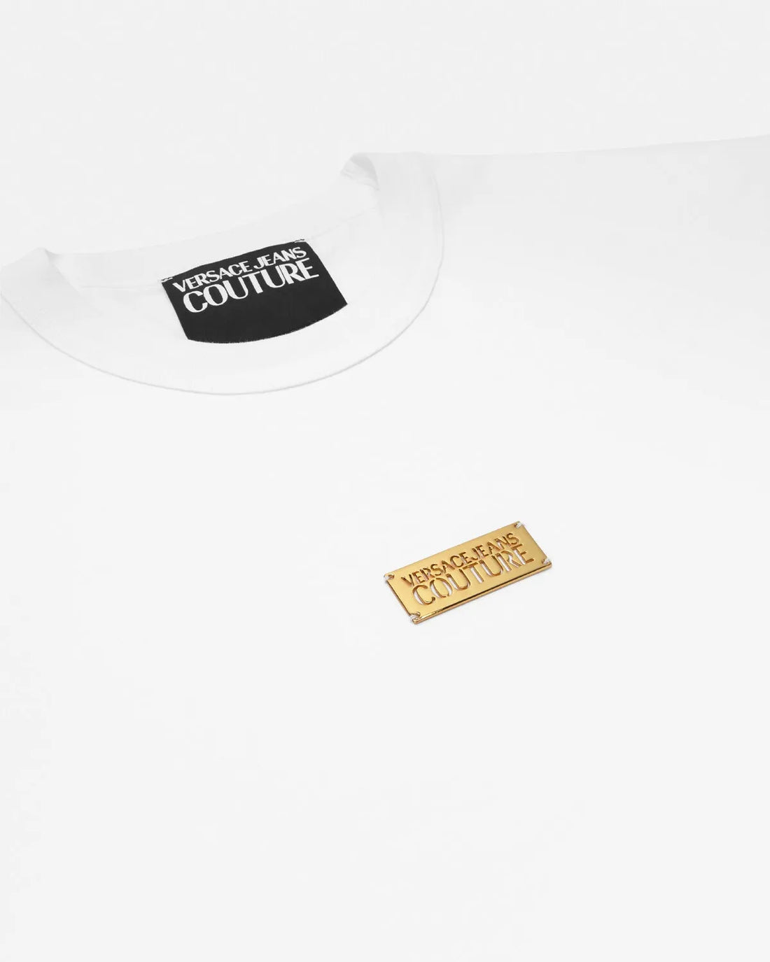 Versace Jeans Couture Metal Logo Plaque T-Shirt in white, featuring a crewneck silhouette and signature metal logo plaque, blending casual elegance with designer appeal, available at Lestyle Boutique.
