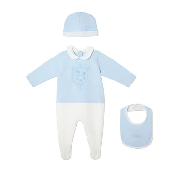 Baby outfit set with blue shirt, white pants, hat, and bib on a white background