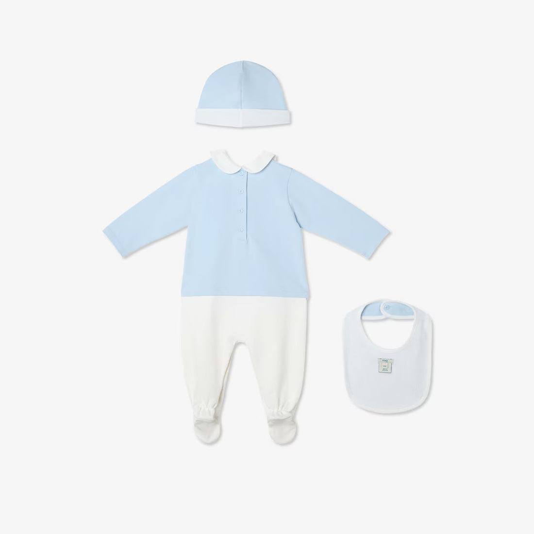 Baby outfit set with blue shirt, white pants, hat, and bib on a white background