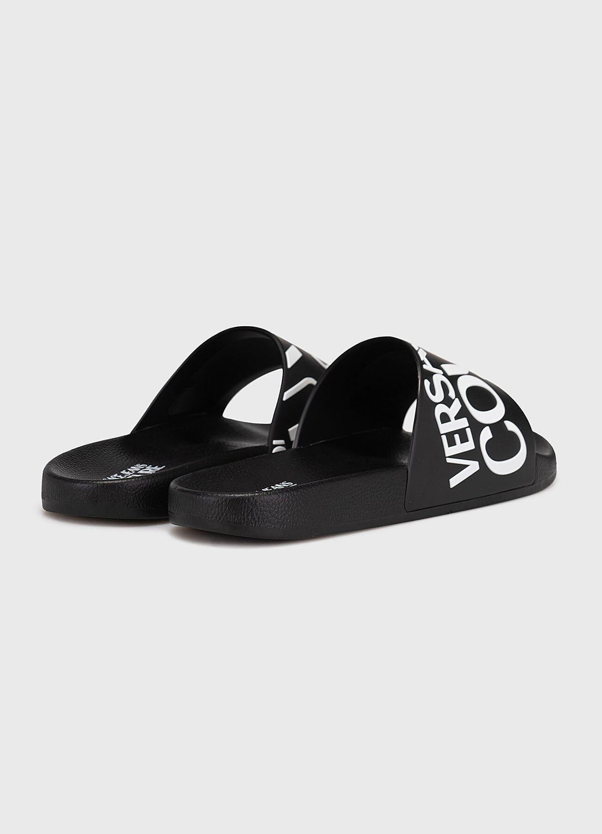Versace Jeans Couture Fondo Slide sandals featuring embossed tonal logo lettering available at Lestyle Boutique Melbourne