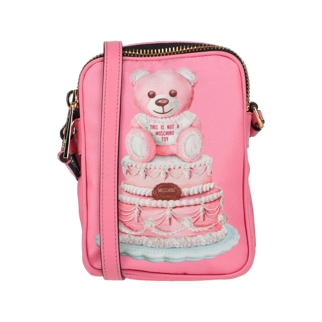 Moschino pink cross-body bag featuring a multicolor Teddy Bear cake print, zip closure, and long strap, Made in Italy, available at Lestyle Boutique 136 Little Collins St.