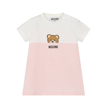 Moschino Kids girls' organic cotton jersey t-shirt dress featuring a white upper and pink lower section, crew neck, short sleeves, and a Moschino Teddy Bear print on the chest, made in Europe, available at Lestyle Boutique 136 Little Collins St.