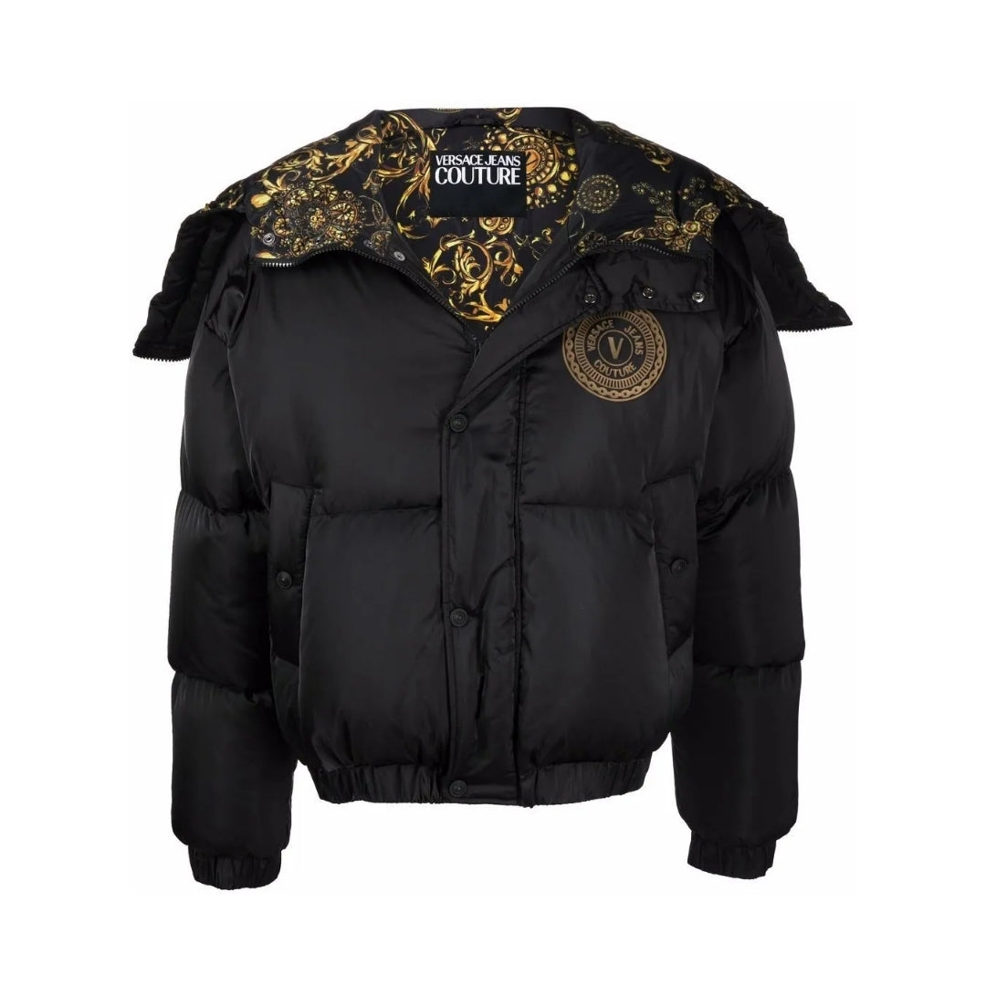 Versace Jeans Couture men's black puffer jacket featuring a hood with gold baroque print lining, a zip front, and a gold V-Emblem logo patch on the chest, available at Lestyle Boutique 136 Little Collins St.